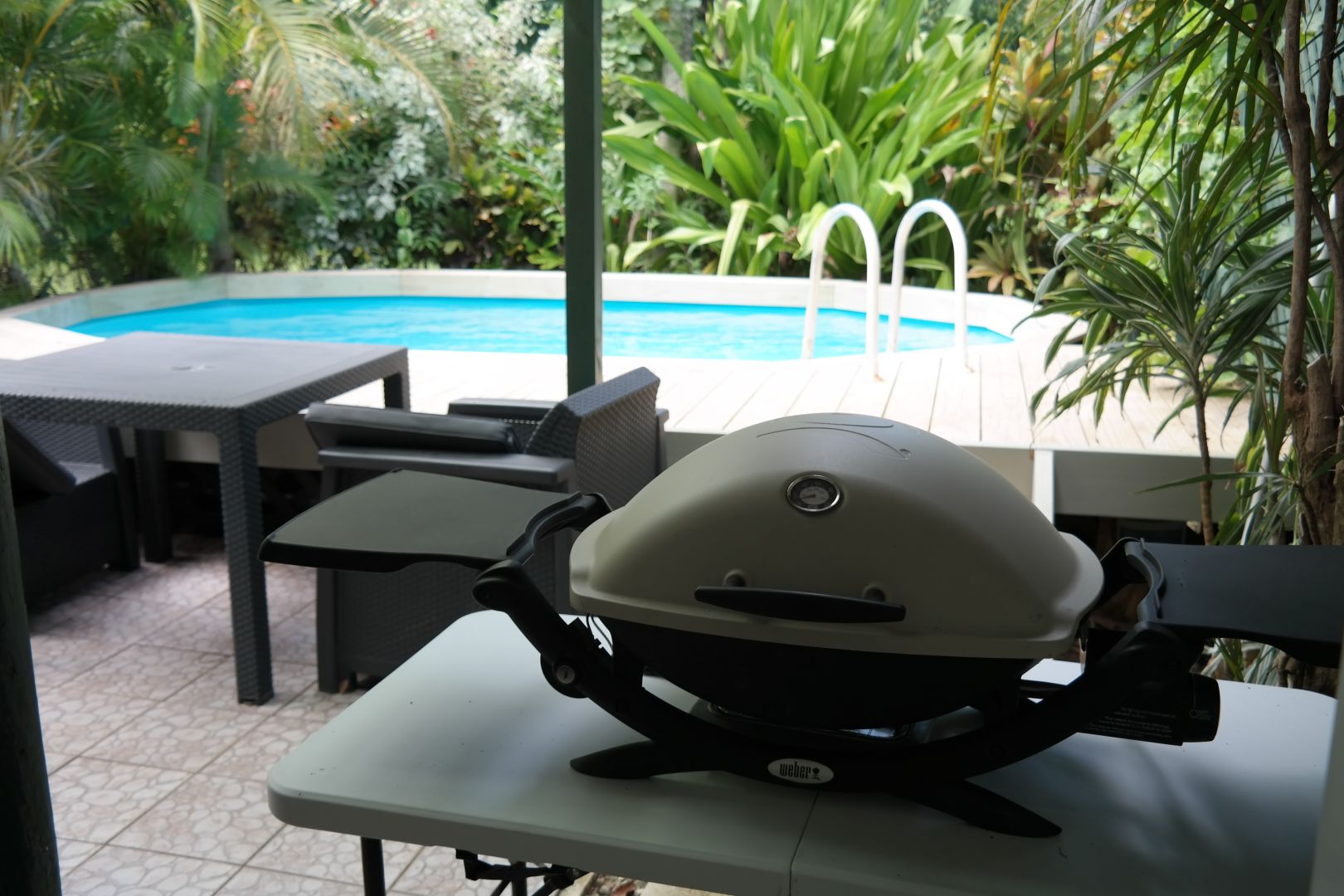 Covered activity hut with BBQ, dining and guest fridge